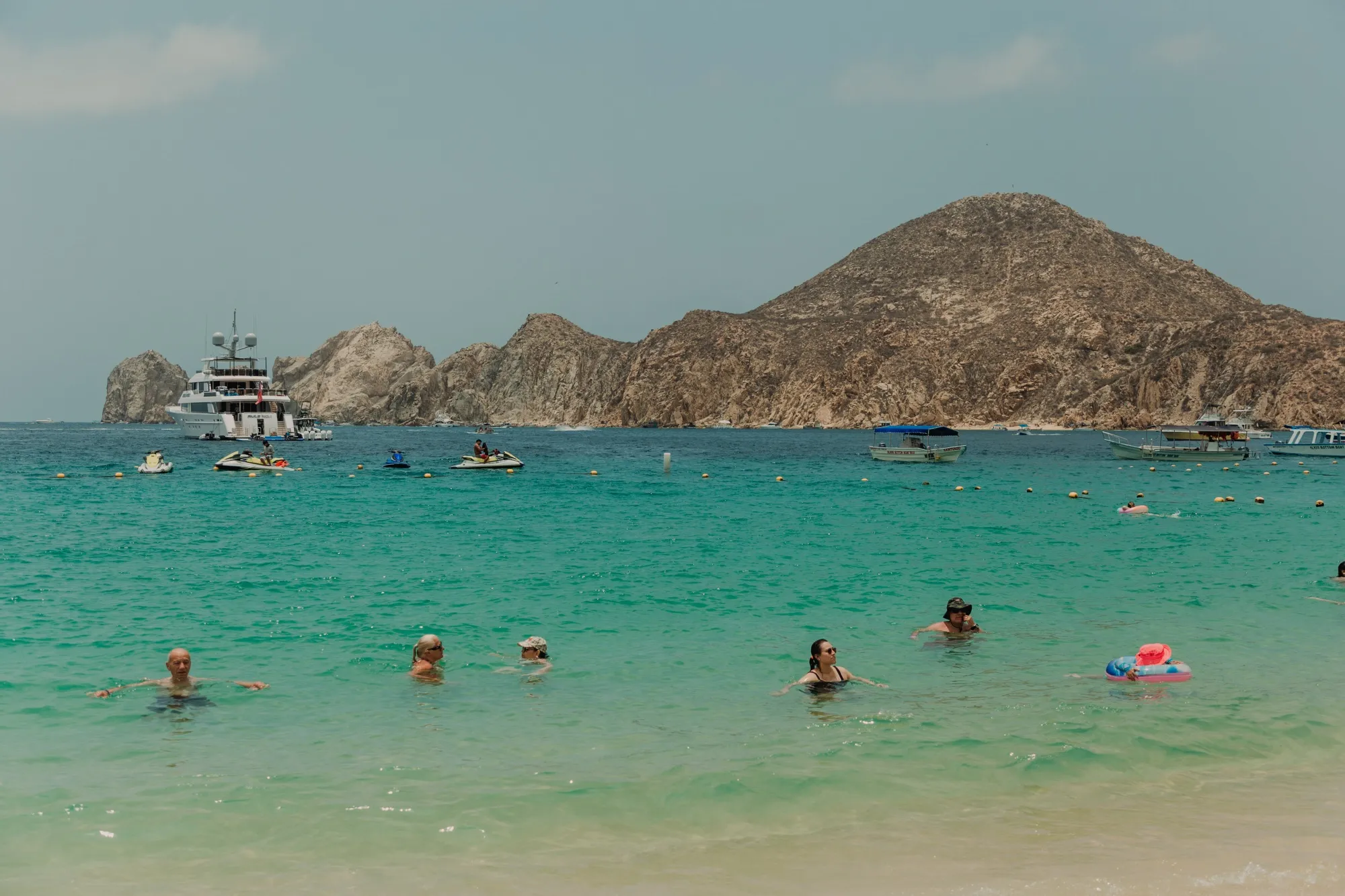 People swim at Medano Beach in Cabo San Lucas,&nbsp;Mexico.