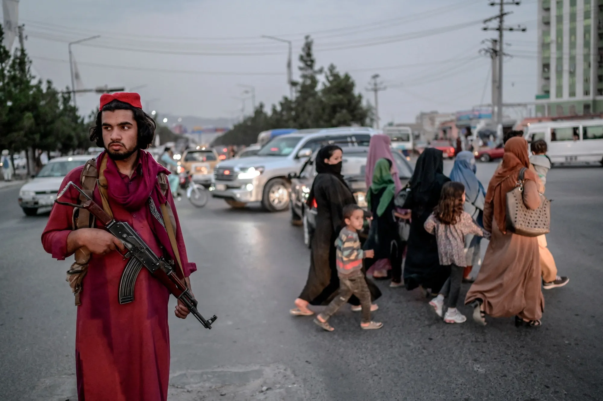 A member of Taliban stands guard along a road in Kabul in September 2021.&nbsp;