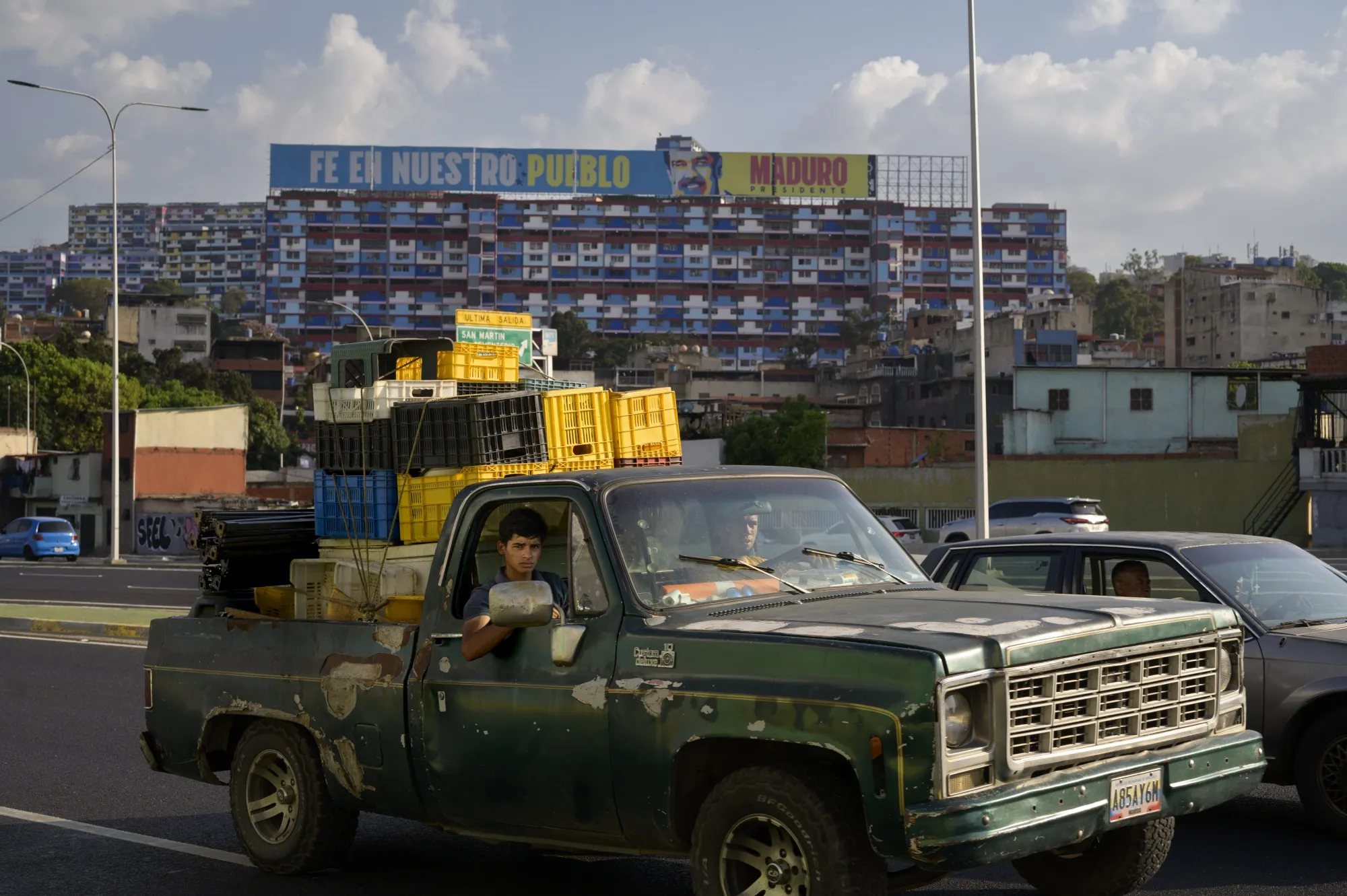 A government billboard along a highway in Caracas reads, in Spanish, “Faith In Our People,” in April 2025.