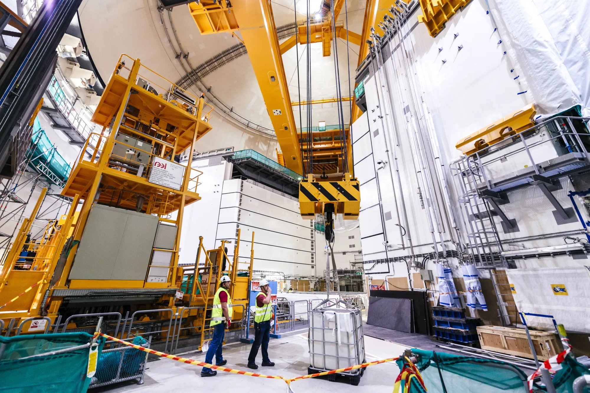 Workers in the reactor hall at the construction site of the Olkiluoto-3 nuclear power plant in Olkiluoto, Eurajoki, Finland.