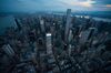 The Manhattan skyline stands at dusk in this aerial photograph taken above New York, U.S.