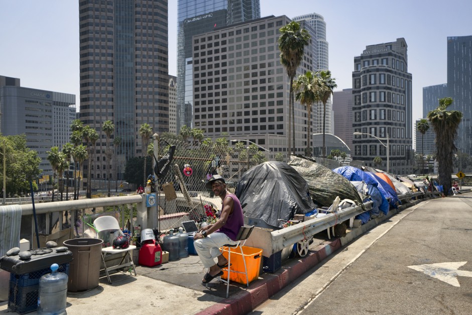 Homeless residents of Los Angeles live in tents along Interstate 110.