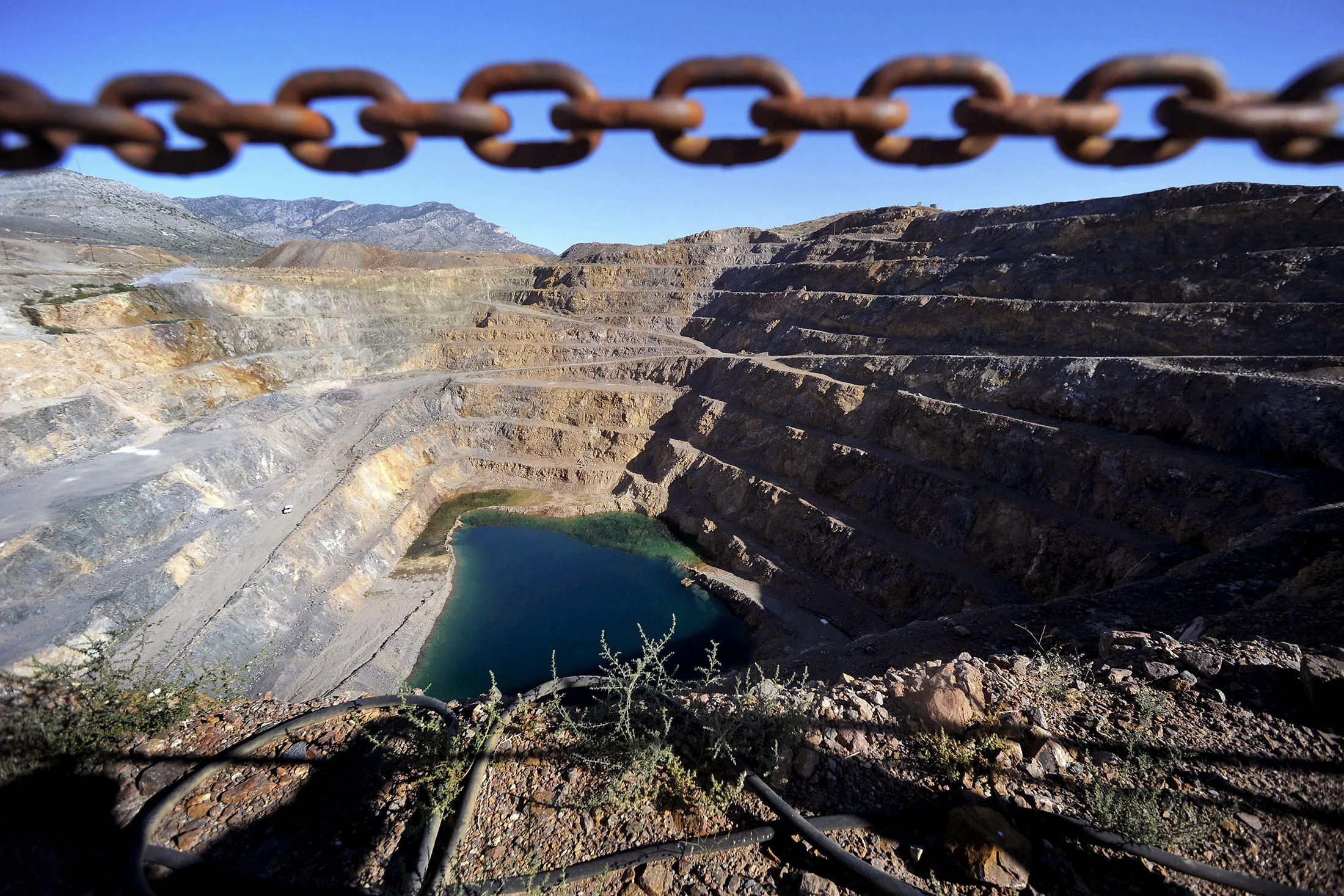Terraced roads line the Molycorp Mountain Pass open pit mine in Mountain Pass, California.
