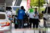 A motorcyclist refuels at a petrol station in Bangkok