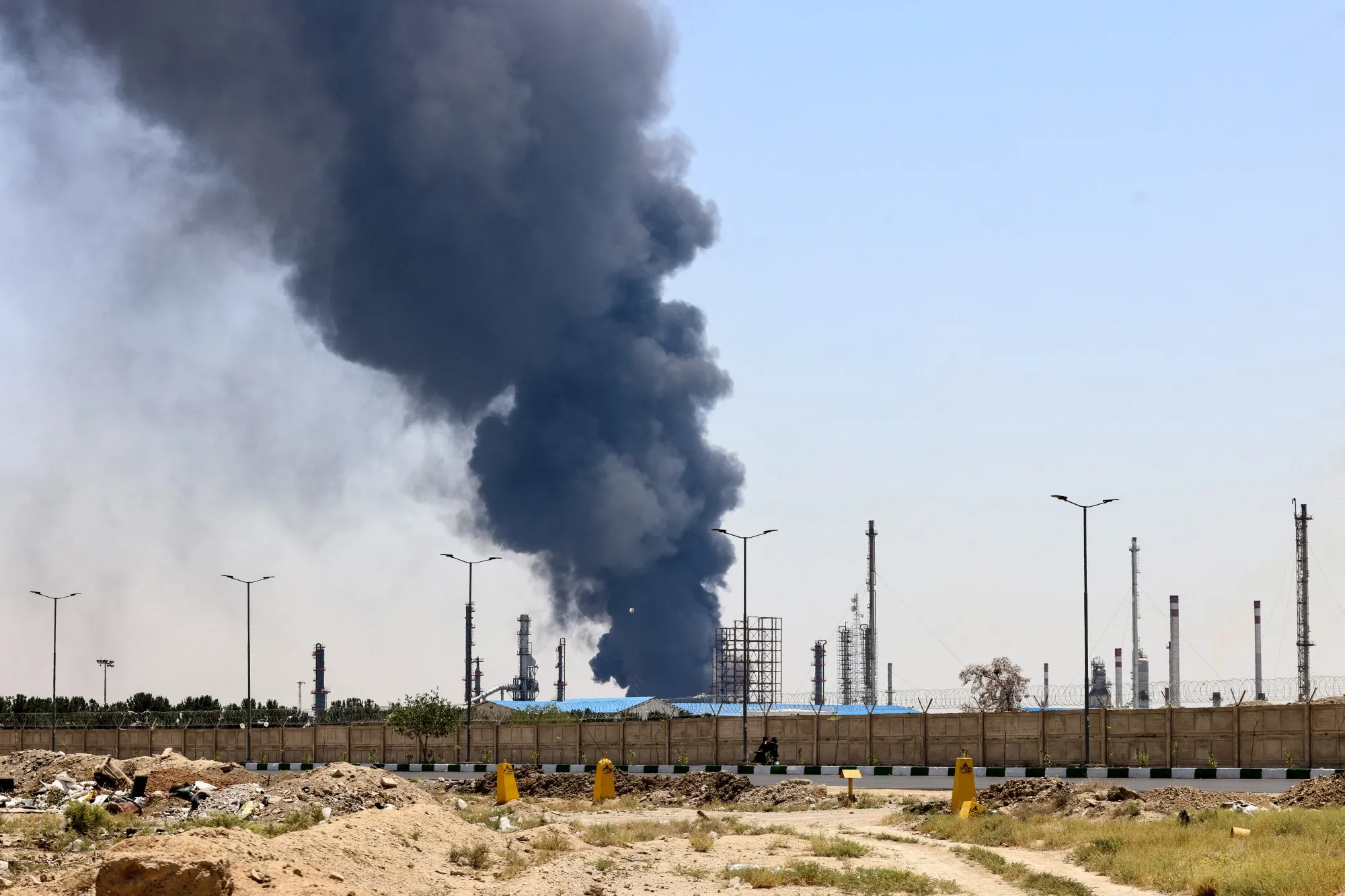 Heavy smoke and fire rise from&nbsp;an oil refinery in southern Tehran&nbsp;after it was hit by&nbsp;an Israeli airstrike&nbsp;June 15.