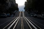 Pedestrians cross San Francisco’s empty&nbsp;California Street.