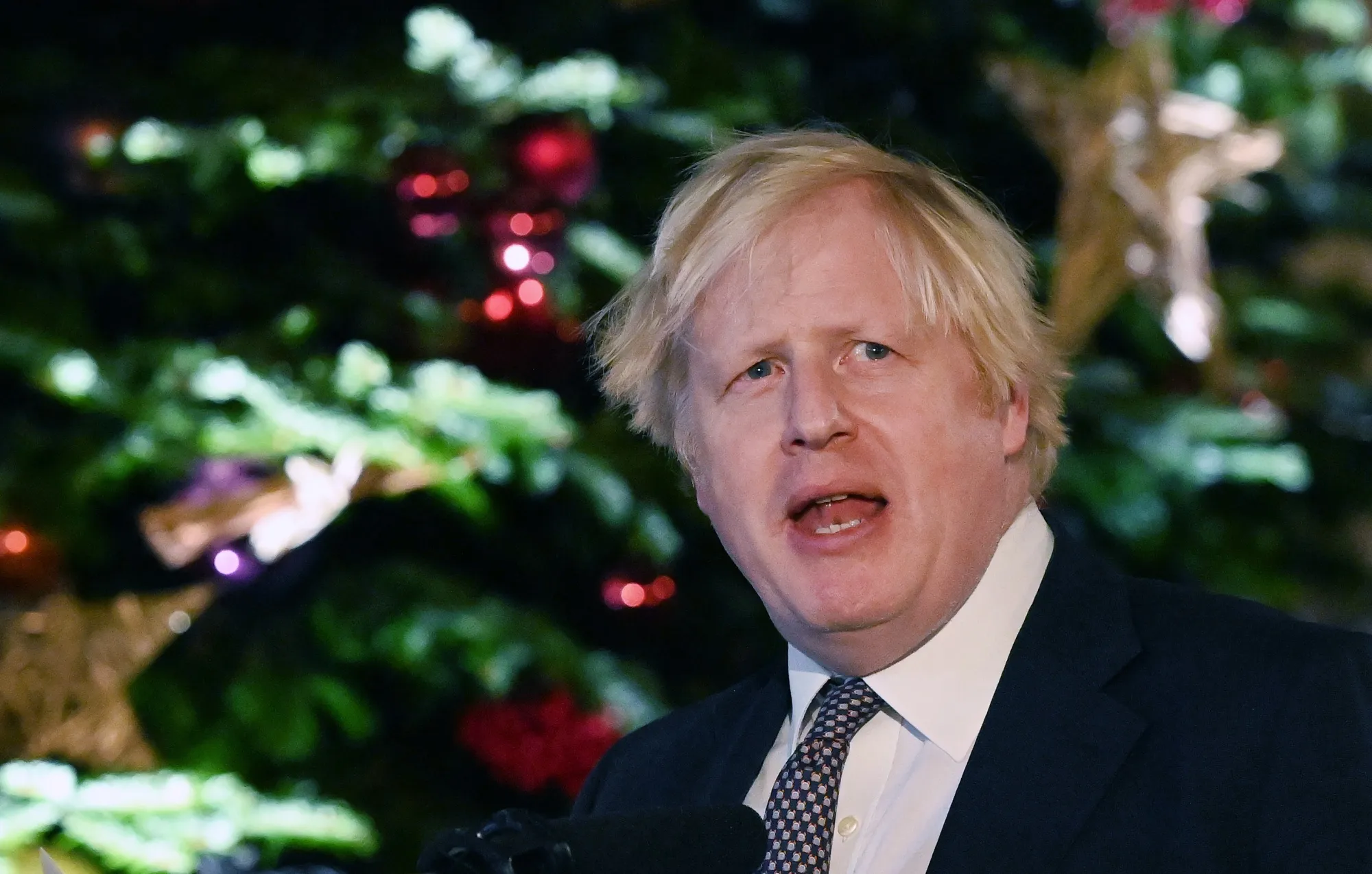 U.K. Prime Minister Boris Johnson speaks outside a food and drink market set up in Downing Street in London on Tuesday.