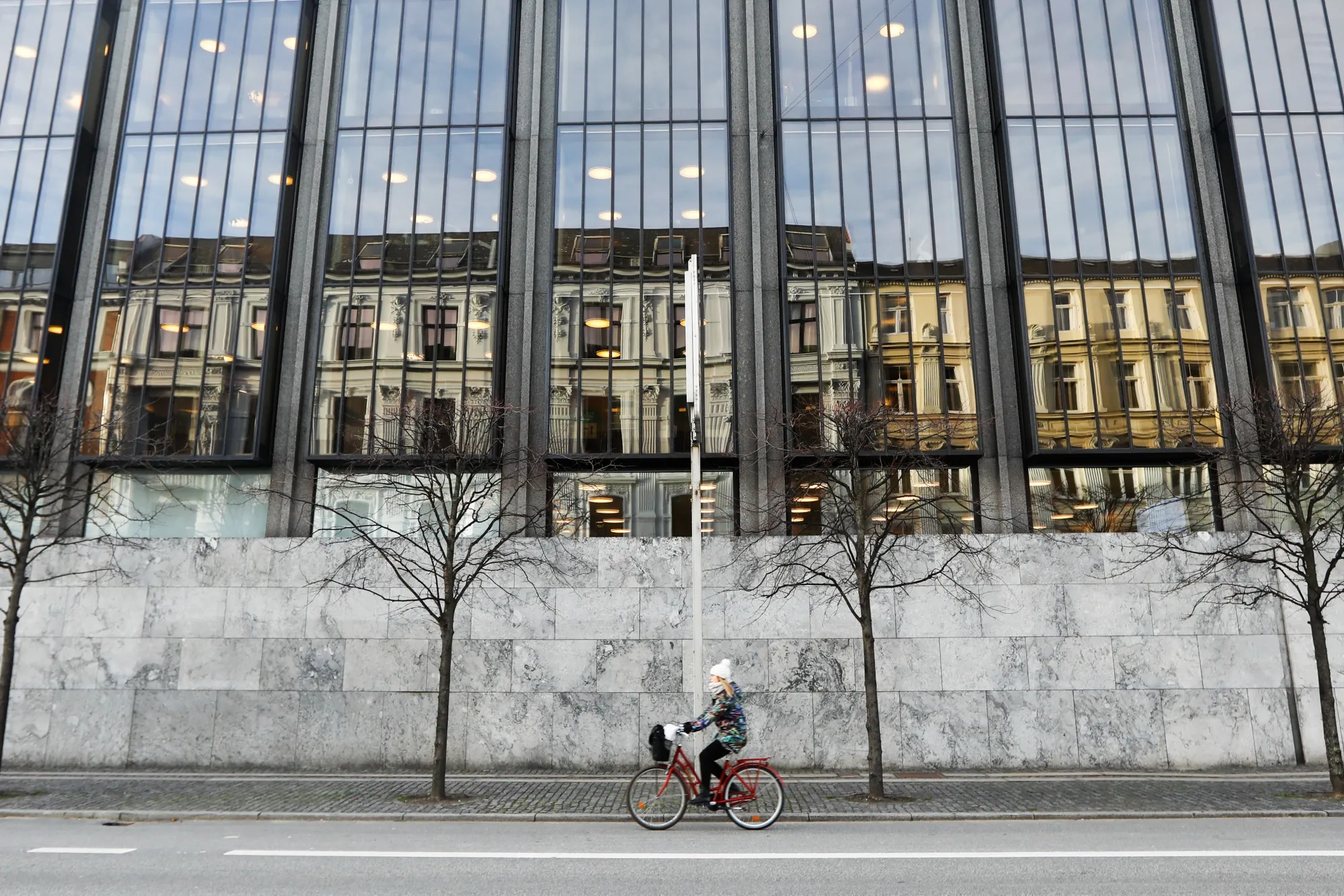 A cyclist passes Denmark's central bank&nbsp;in Copenhagen.