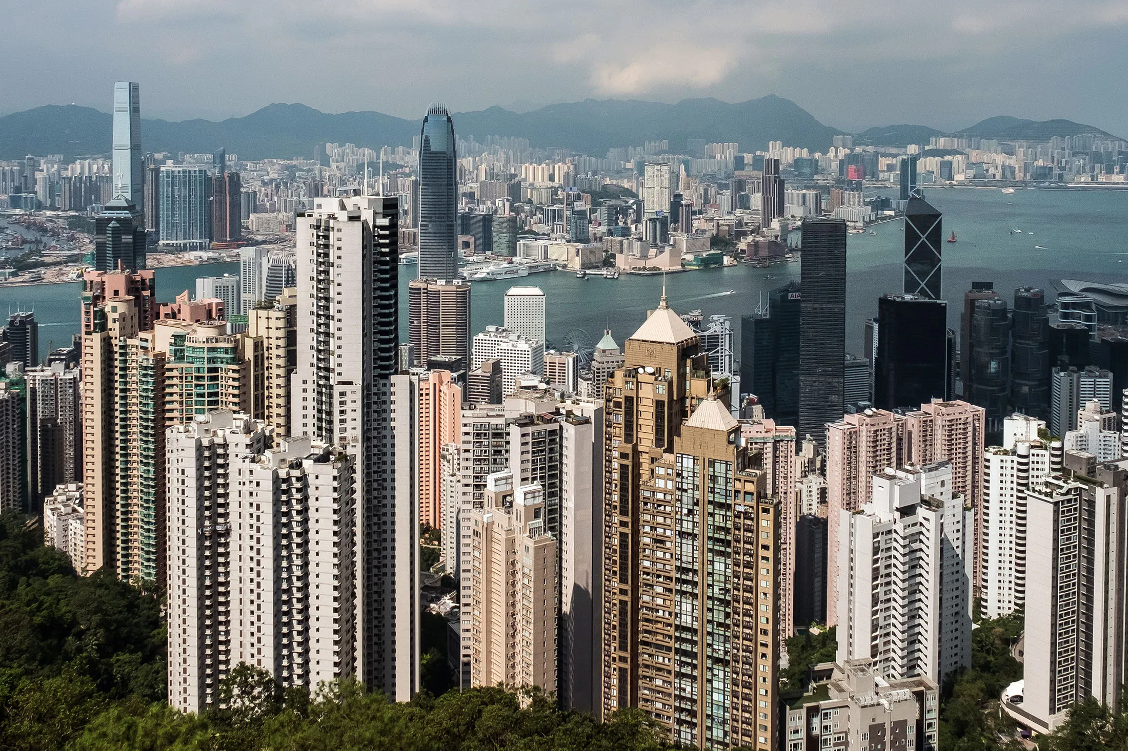 Residential and commercial buildings are seen from Victoria Peak in Hong Kong, China, on Monday, Sept. 11, 2017. Hong Kong stocks fluctuated on Sept. 12 as automakers extended gains driven by China\'s plan to phase out fossil-fuel vehicles, while banks and property companies weighed on the benchmark index.