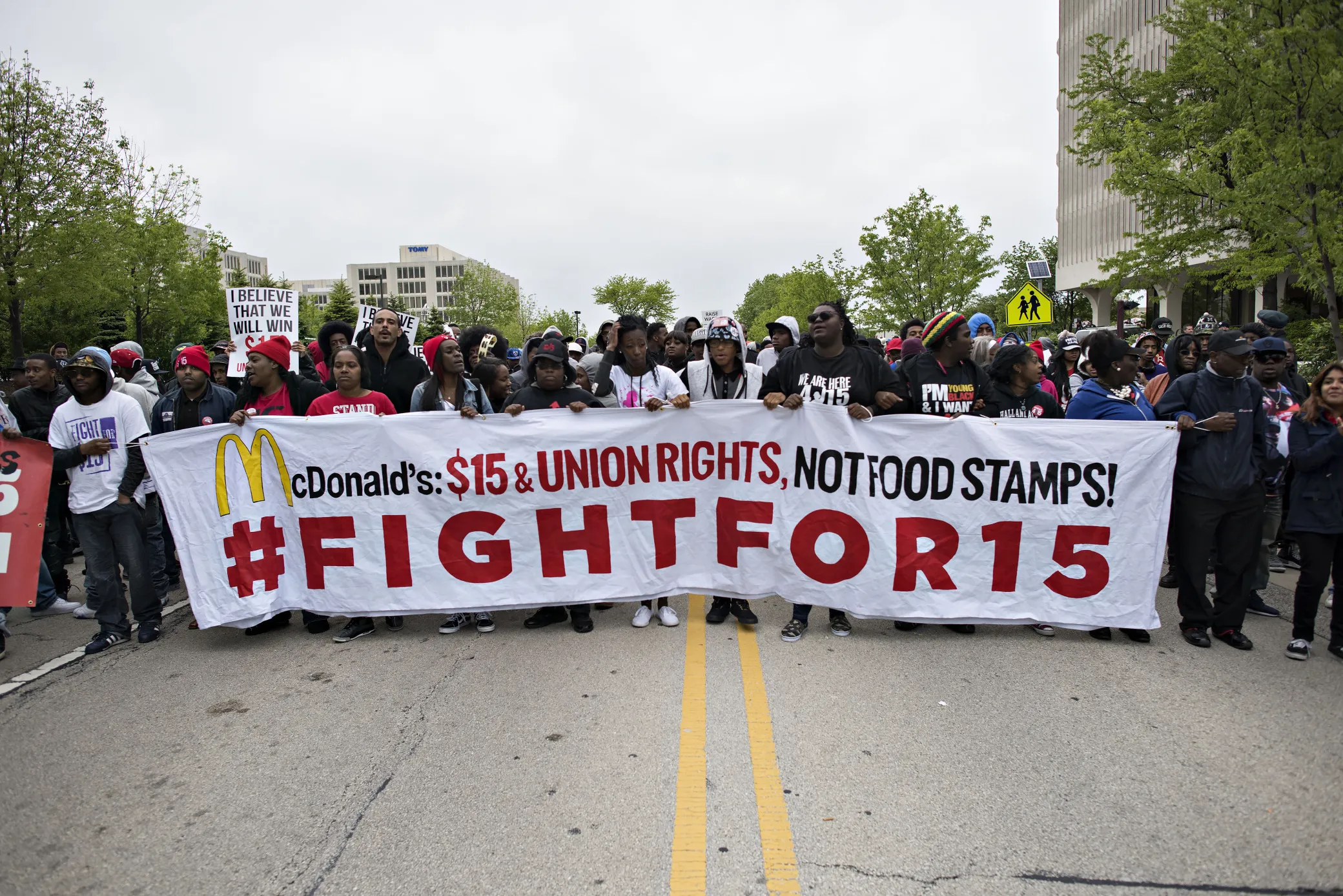 Demonstrators march during a rally near McDonald's headquarters in Oak Brook, Illinois, on May 20, 2015.