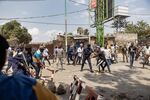 Congolese policemen clash with demonstrators in Goma on June 15.