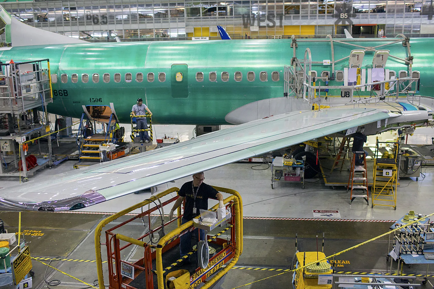 Workers assemble a Boeing Co. 737 airplane on line 2 at the company's factory in Renton, Washington. Photographer: Mike Kane/Bloomberg
