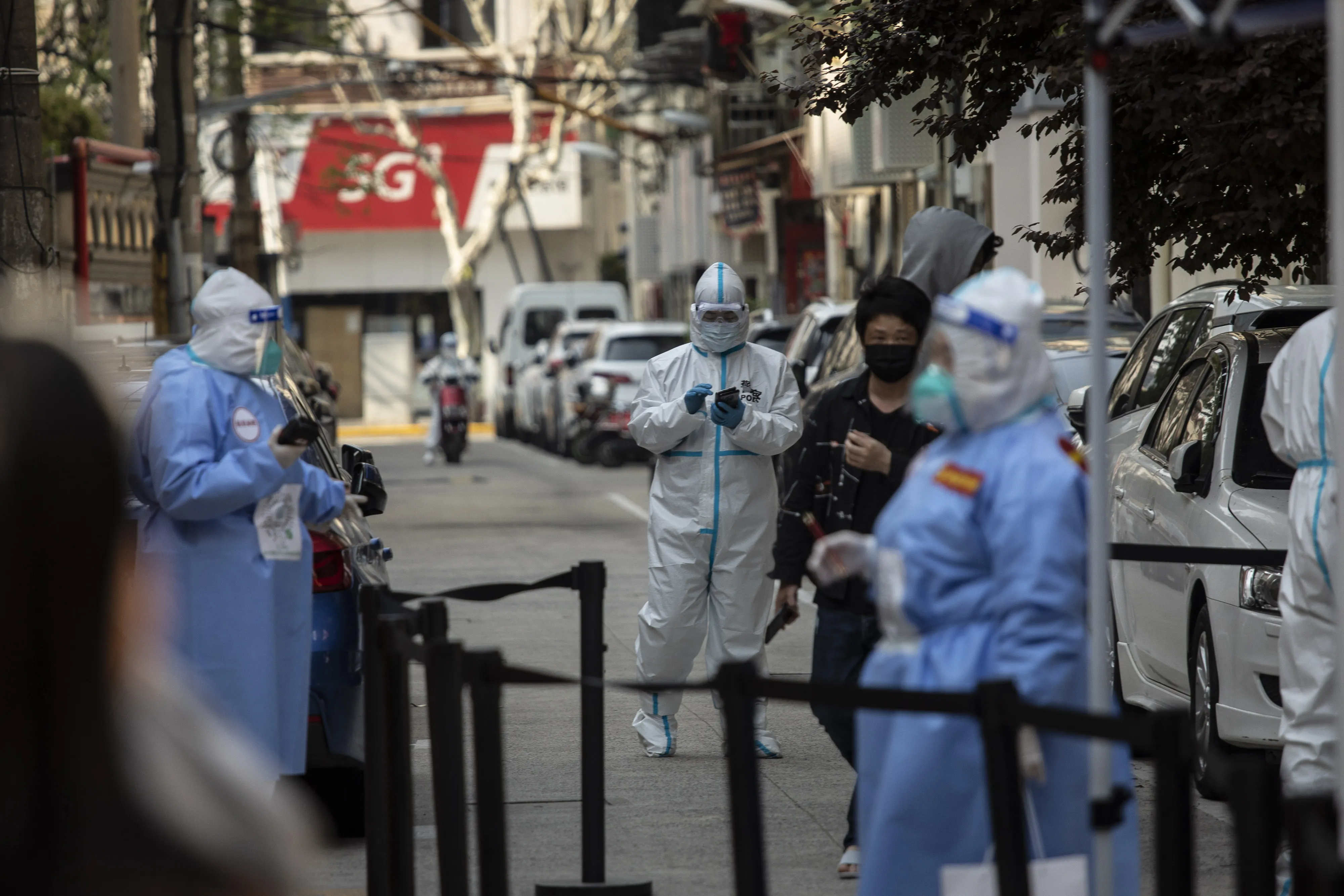 Workers&nbsp;facilitate a round of Covid-19 testing during a lockdown in Shanghai, on April 7.