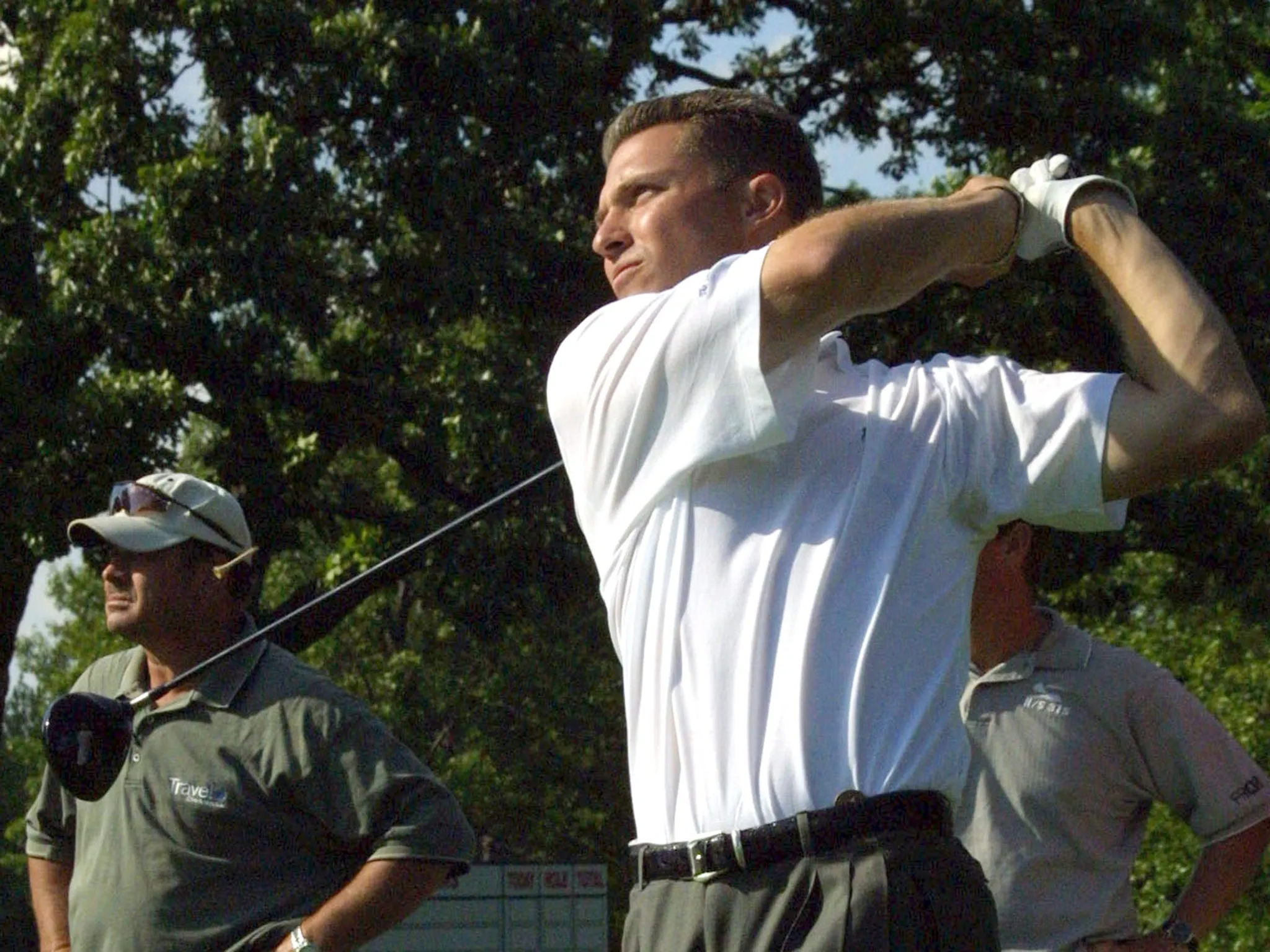 Trip Kuehne tees off during a practice round at the Olympia Fields Country Club in Illlinois, in 2003.
