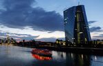 The European Central Bank&nbsp;headquarters, right, at dusk in Frankfurt.