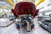 An employee works on an Aston Martin DBX SUV at the company's factory in St Athan, UK.