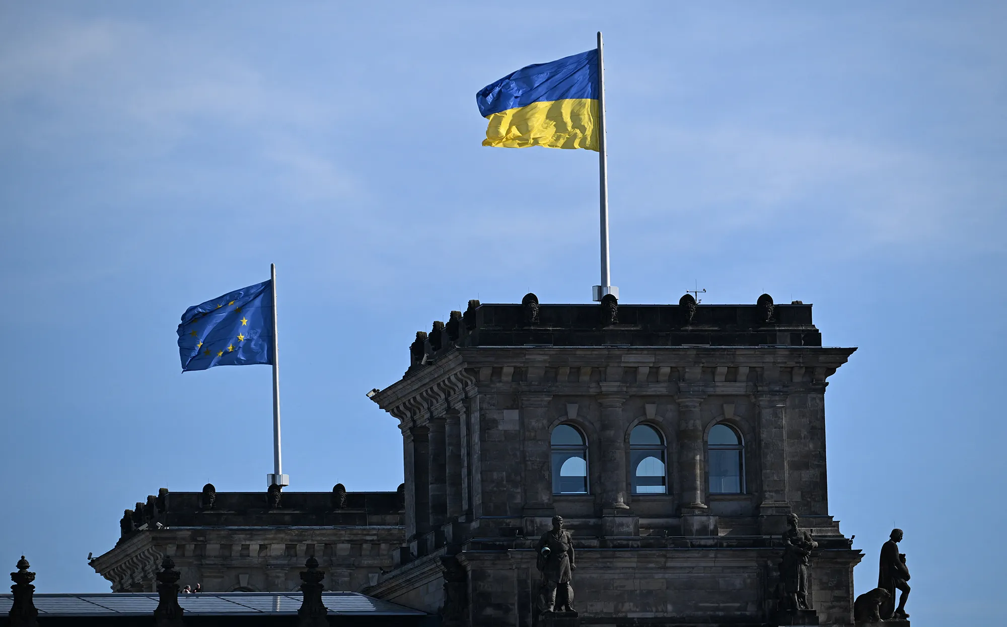 A Ukrainian flag and a flag of Europe at the Reichstag building&nbsp;in Berlin. Germany.&nbsp;