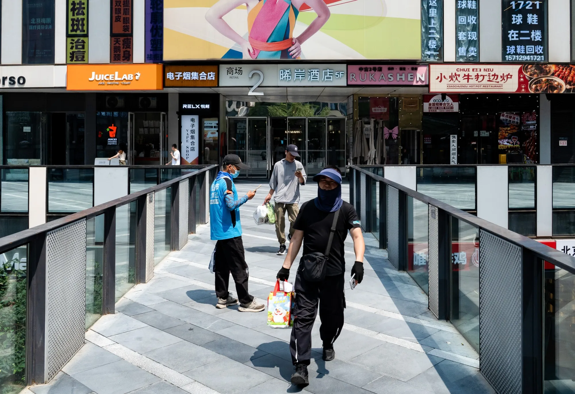 
Delivery workers in Beijing in July
