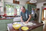 Bread baker Mark Stambler prepares artisanal bread at his home in Los Angeles. Stambler advocated for legislation to allow certain homemade foods to be sold to stores, restaurants, and customers.&#13;
