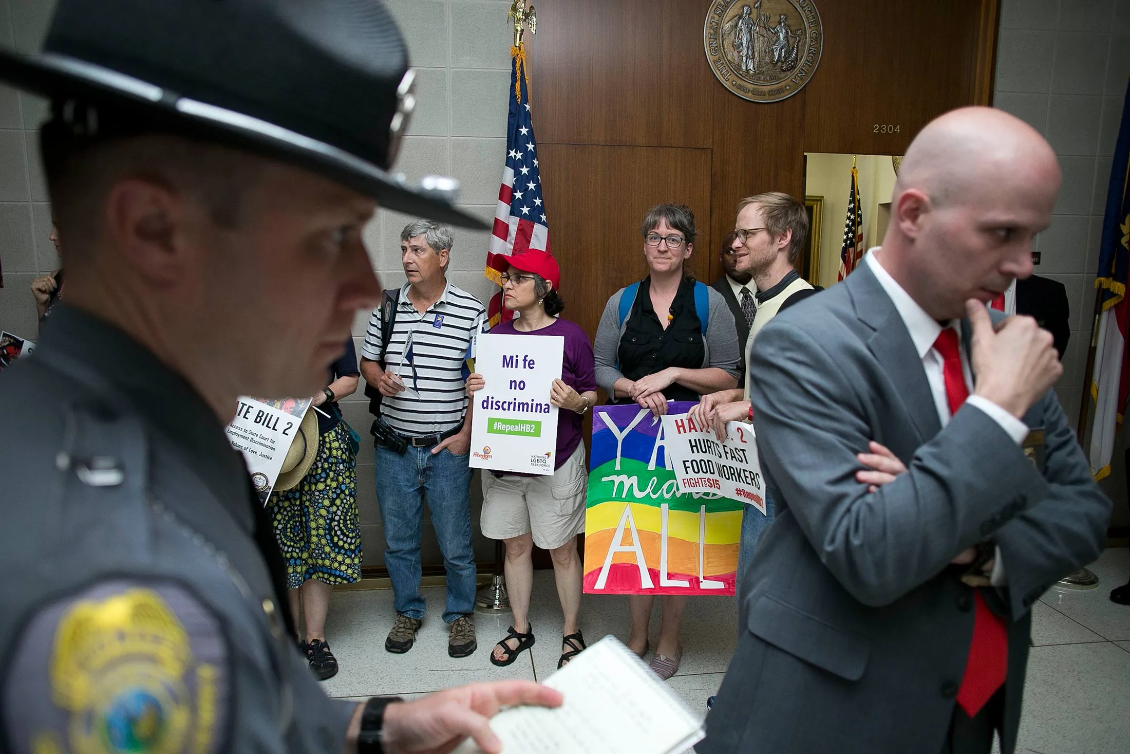Surrounded by security, activists against North Carolina’s “bathroom bill” protest outside the office of House Speaker Tim Moore at the State Legislative Building in Raleigh, N.C., on April 25.
