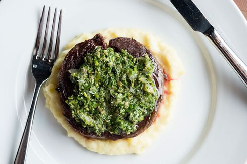 The dainty-looking Bowery steak, a rolled-up ribeye cap on mashed potato with salsa verde.