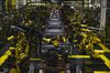 Robotic arms operate on the bed frame of a truck at the Ford Motor Co. Dearborn Truck Plant in Dearborn, Michigan, U.S., on Thursday, Sept. 27, 2018. Ford Motor Co. is watching trade talks closely. With almost 40 percent of its revenue coming from outside North America and factories in Mexico and Canada, the second-largest U.S. automaker has a lot at stake in the outcomes of the Trump administration's myriad negotiations and tariff schemes.