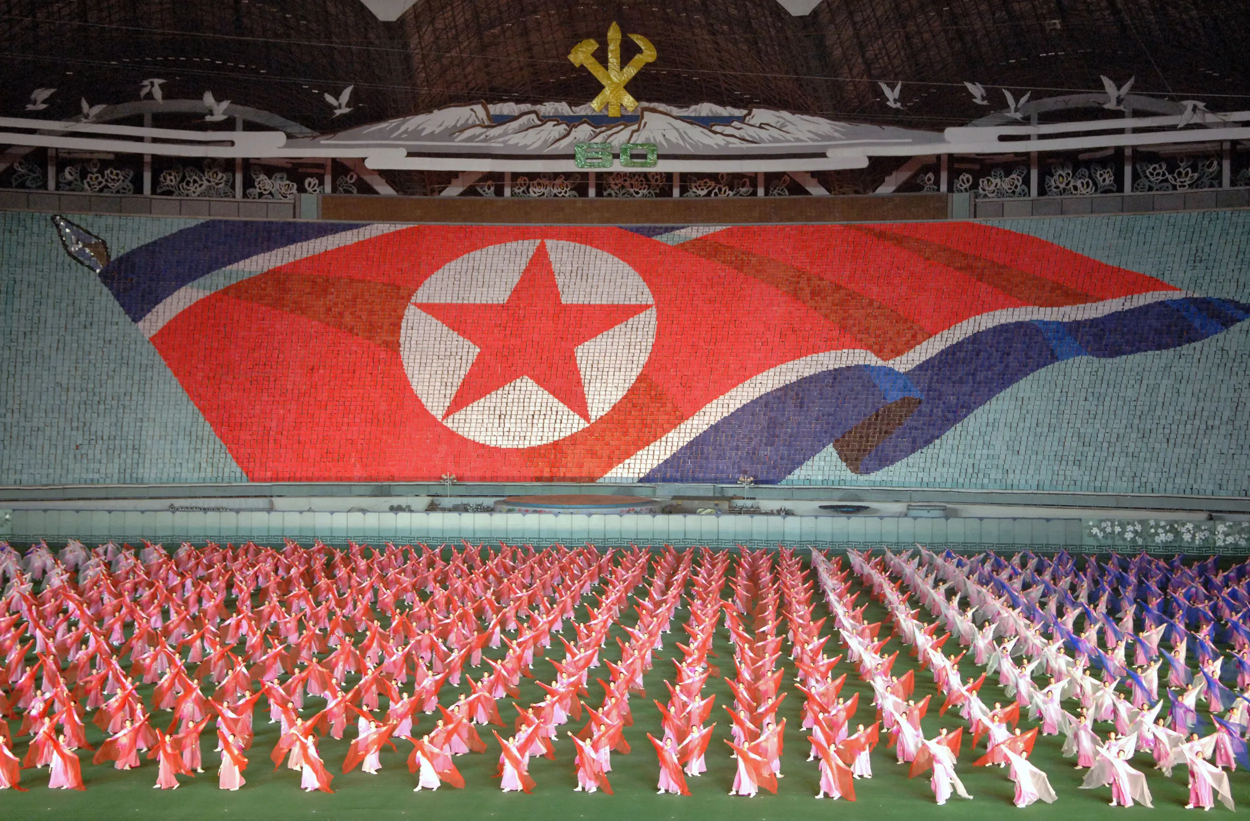 North Koreans perform in the May Day Stadium in Pyongyang during the Arirang Mass Games Thursday, October 6, 2005. The north's government opened the capital to South Korean tourists as part of celebrations of the 60th anniversary of the country's founding.