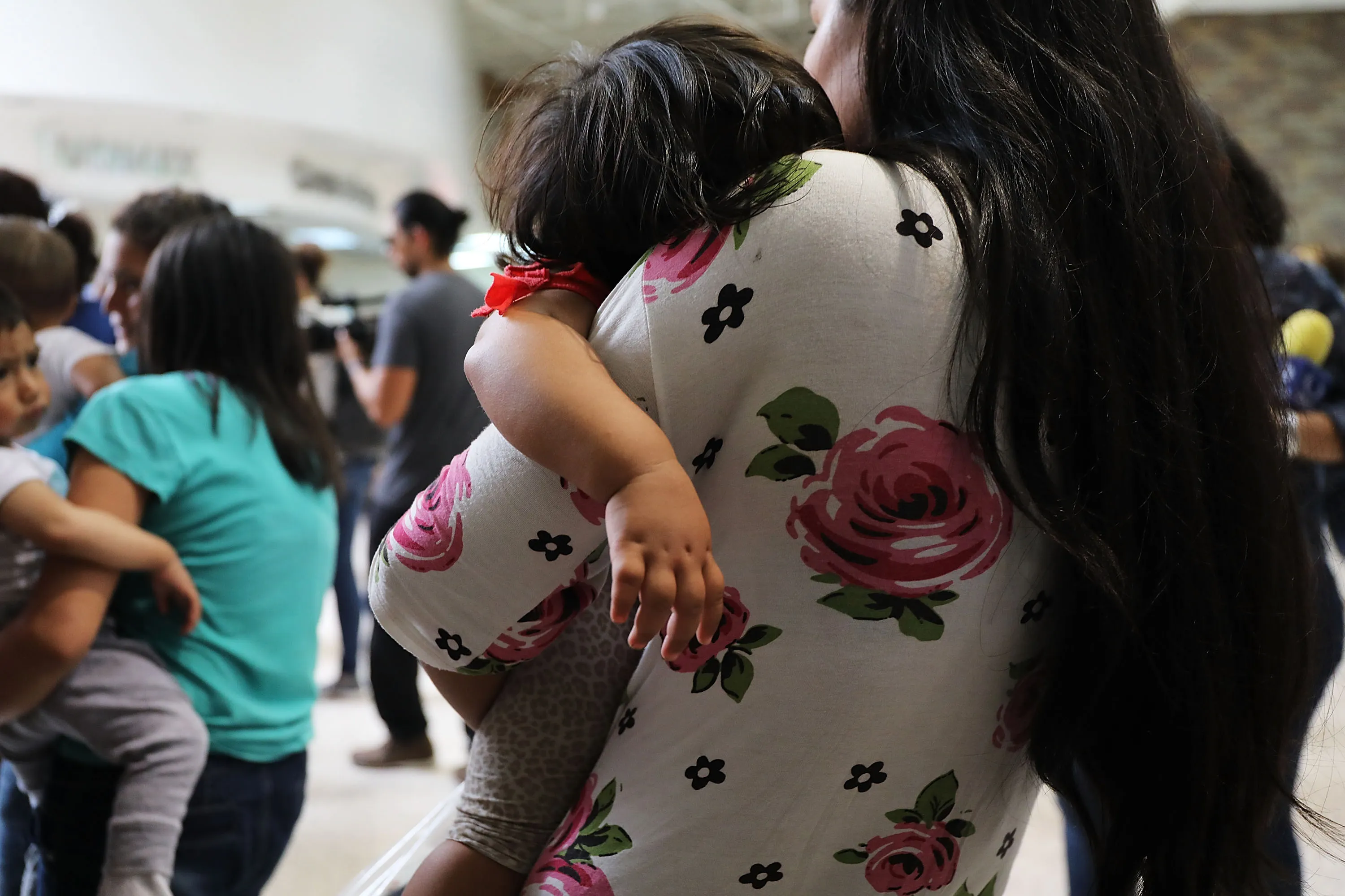 Women and their children arrive at a bus station following release from Customs and Border Protection in McAllen, Texas.&nbsp;