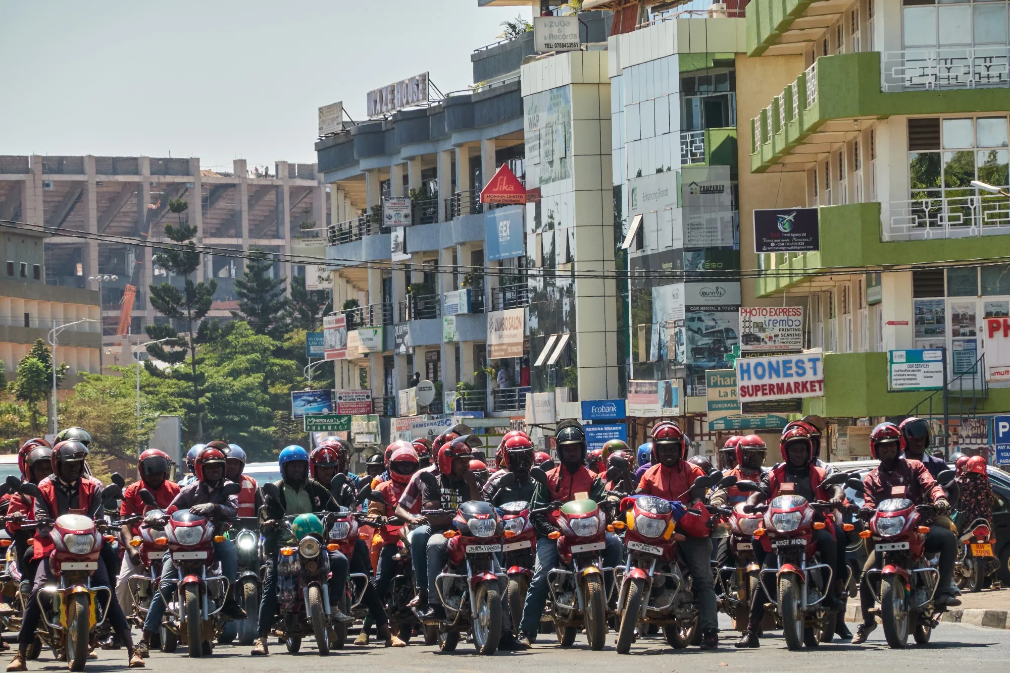 Motorcycle taxi riders wait at a traffic light in the Gasabo district of Kigali, Rwanda.
