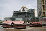 Ferries travel along Chao Phraya River in Bangkok.