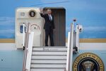 U.S. President Barack Obama waves from the steps of Air Force One on April 24, 2016.
