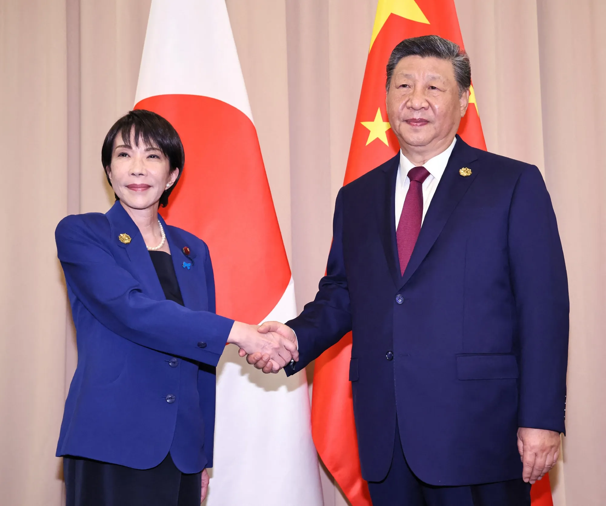 Japan’s Prime Minister Sanae Takaichi, left, and China’s President Xi Jinping in South Korea on Oct. 31.