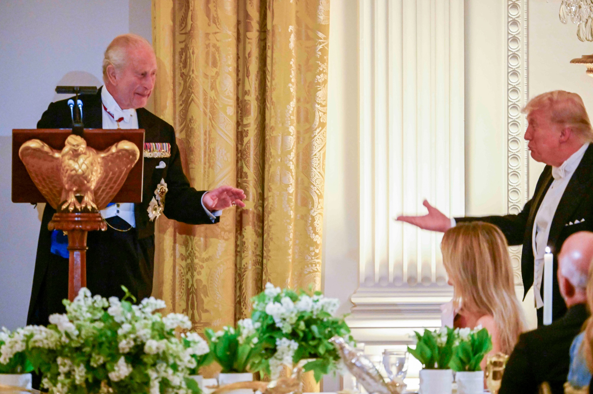 King Charles III, left, and US President Donald Trump during a state dinner in the East Room of the White House in Washington, DC, US, on Tuesday, April 28, 2026. The long-planned event is intended to mark the 250th anniversary of the US’s independence from Britain, though its diplomatic mission has taken on new urgency amid Trump’s recent feud with Prime Minister Keir Starmer over the UK’s limited support for US military action against Iran. Photographer: Craig Hudson/The Washington Post/Bloomberg