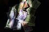 Argentine 100, 200, 500 and 1000 peso banknotes are arranged for a photograph in Buenos Aires, Argentina, on Saturday, March 30, 2019. Argentina's central bank has taken enough steps in the past month to prevent the recent slump in the peso turning into a repeat of last year's rout, according to strategists and traders.