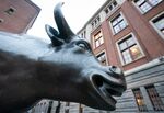 A bull statue stands outside Amsterdam Stock Exchange, operated by Euronext NV, in Amsterdam, Netherlands.