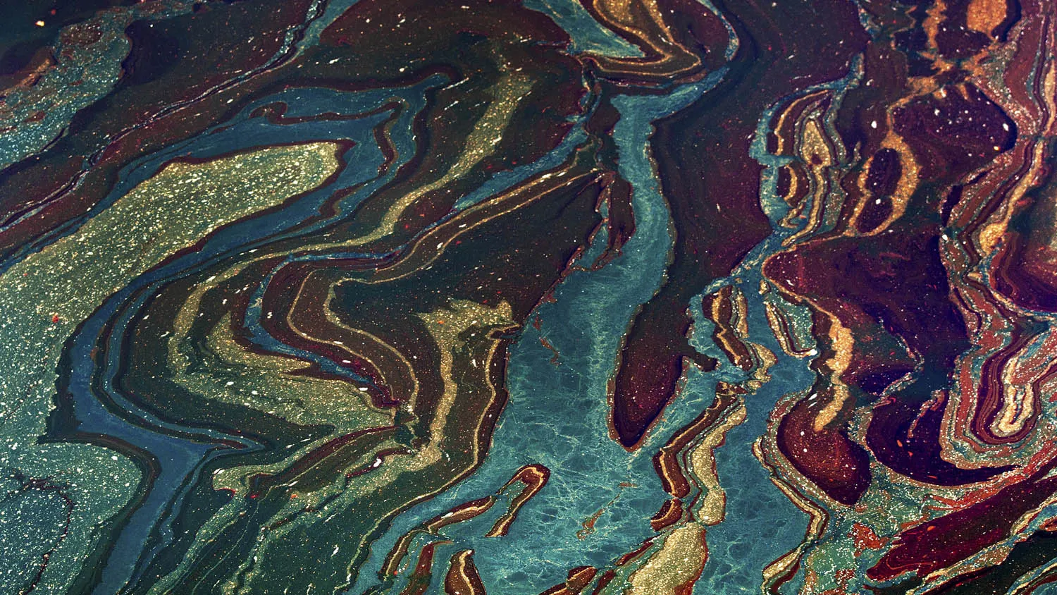 Oil floats in the Gulf of Mexico near Orange Beach, Alabama, U.S., on Friday, June 18, 2010.
