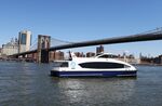 A Ferry crosses the East River at Brooklyn Bridge Park.
