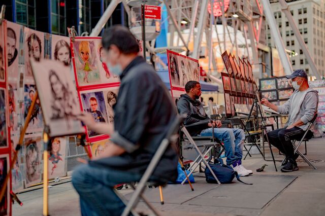 People getting their portraits drawn in Times Square on September 4, 2021