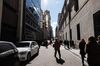 Pedestrians walk down a street in the financial district of Buenos Aires, Argentina, on Tuesday, Aug. 13, 2019. In the wake of President Mauricio Macri's stunning rout in primary elections over the weekend, investors dumped its stocks, bonds and currency en masse, leaving much of Wall Street wondering whether the country was headed for yet another default.