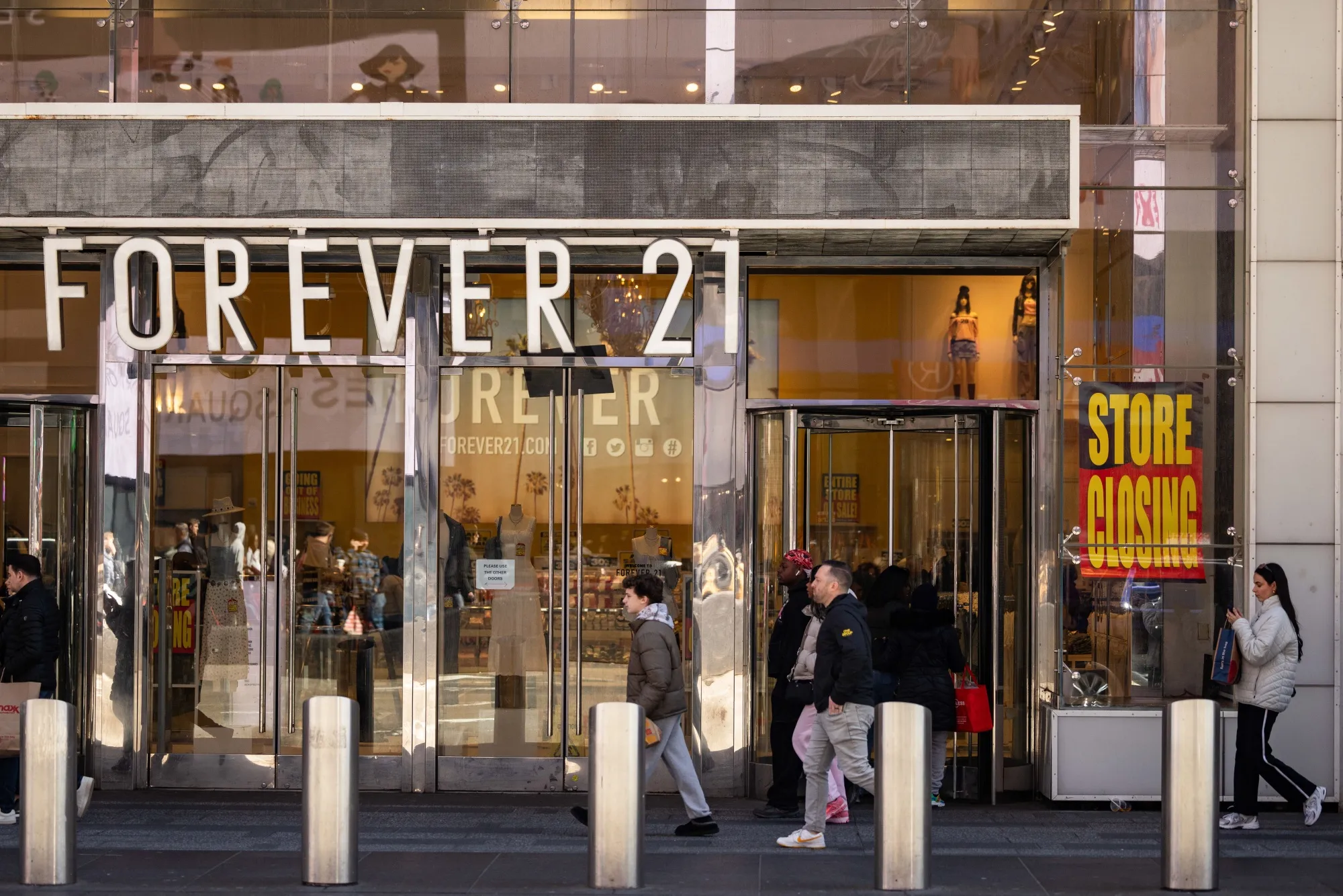 A "Store Closing" sign displayed outside a Forever 21 store in New York in March.