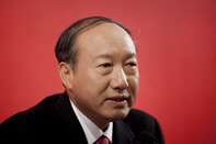 Chairman Of HNA Group Chen Fent At A News Conference