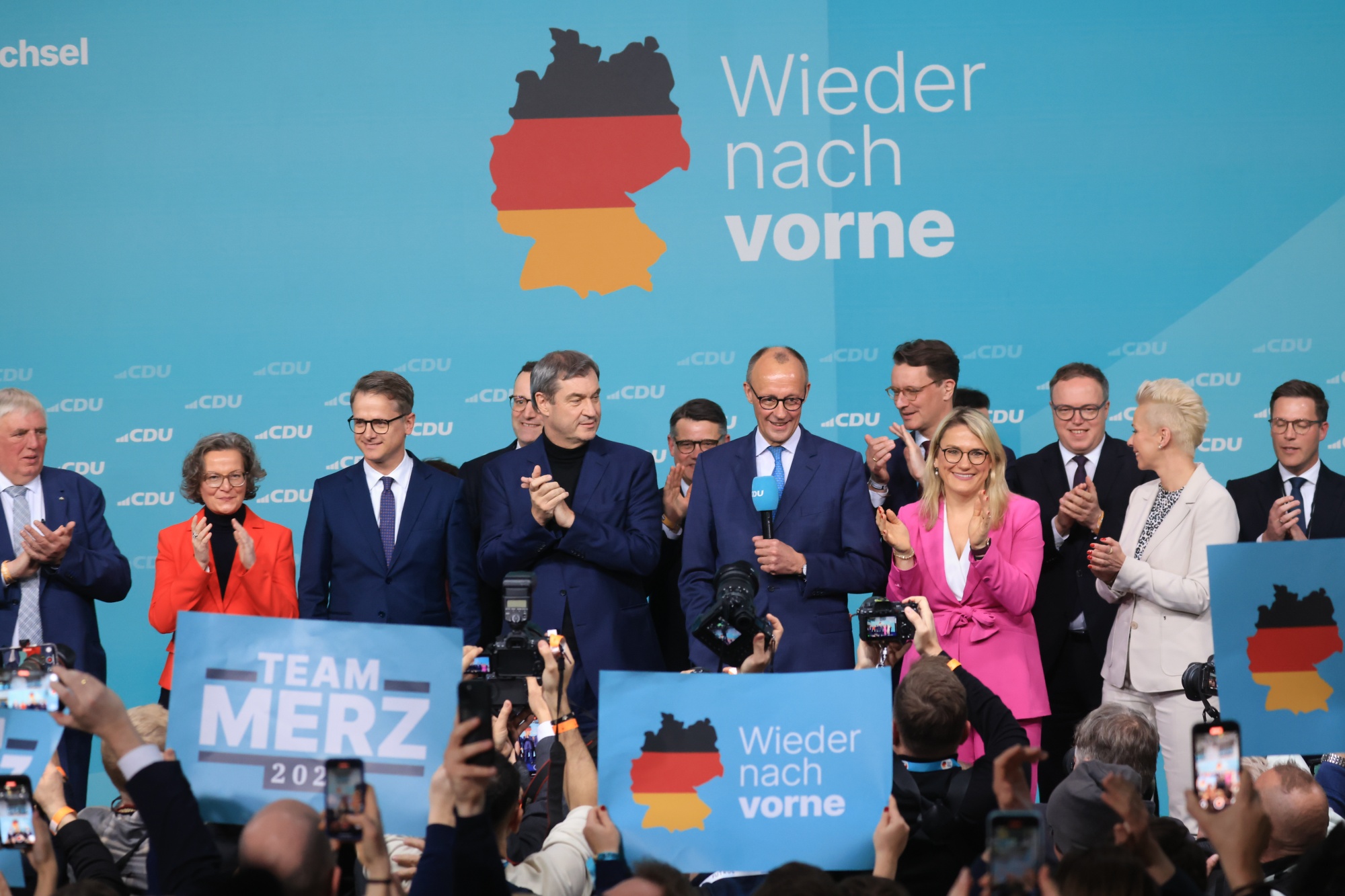 Friedrich Merz, center, delivers a speech at the CDU election night event in Berlin, on Feb. 23.