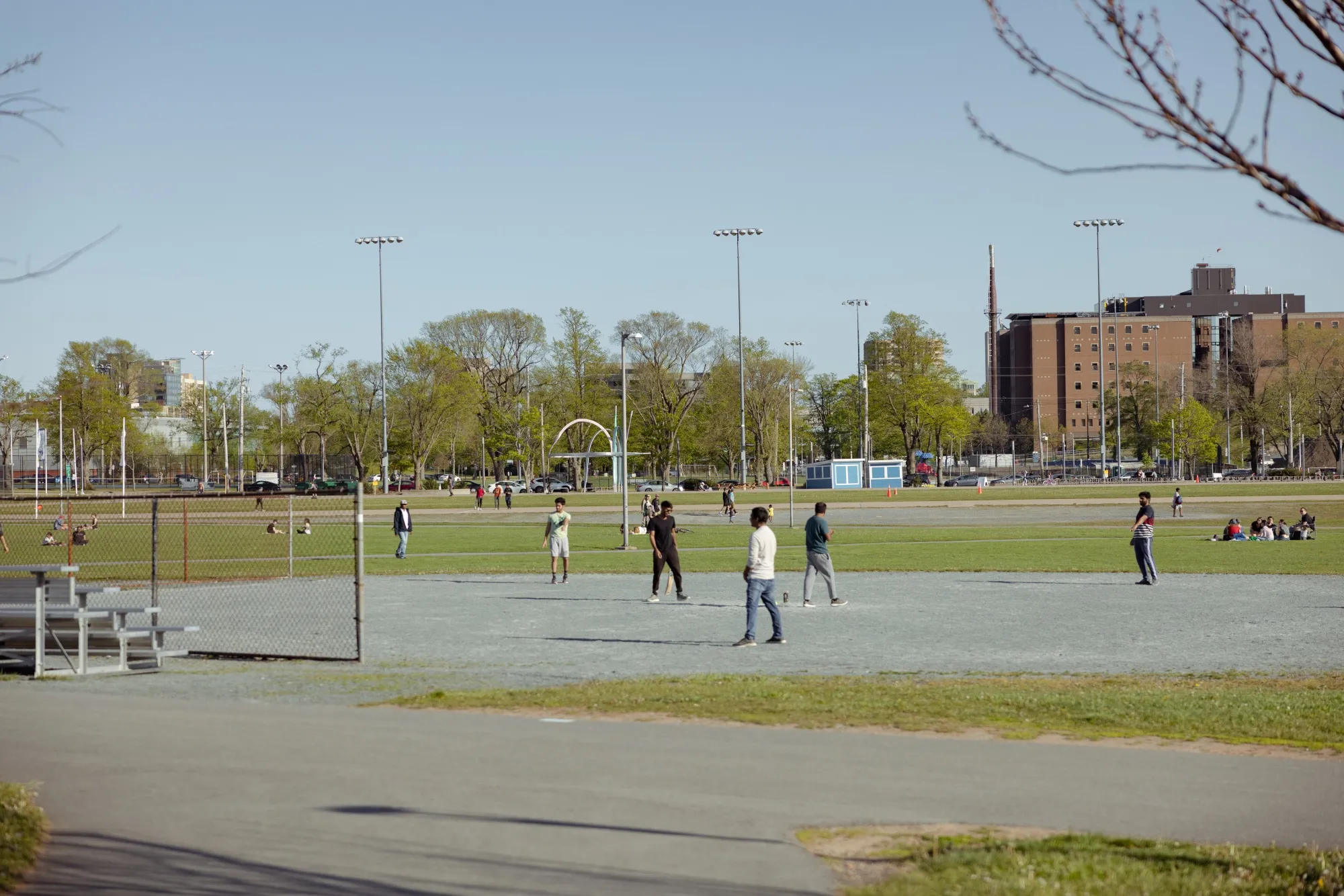 Visitors play cricket at the Halifax Commons park in Halifax.
