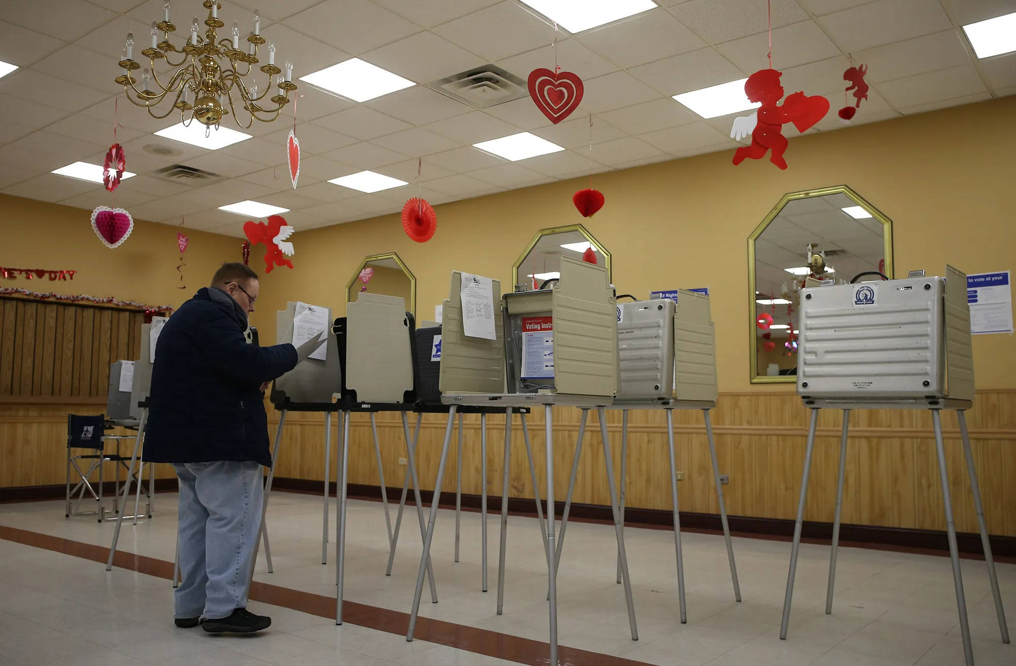 Tim Geary casts his vote during election day in a polling place in Chicago, Feb. 26, 2019.&nbsp;