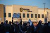 Demonstrators hold signs during a protest at the Amazon fulfillment center in Shakopee, Minnesota, on Dec. 14, 2018.