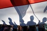 Poland’s national flag is unfurled during a demonstration against Polish government actions that impinge on the independence of the country’s judiciary system&nbsp;on July 24 in Warsaw.