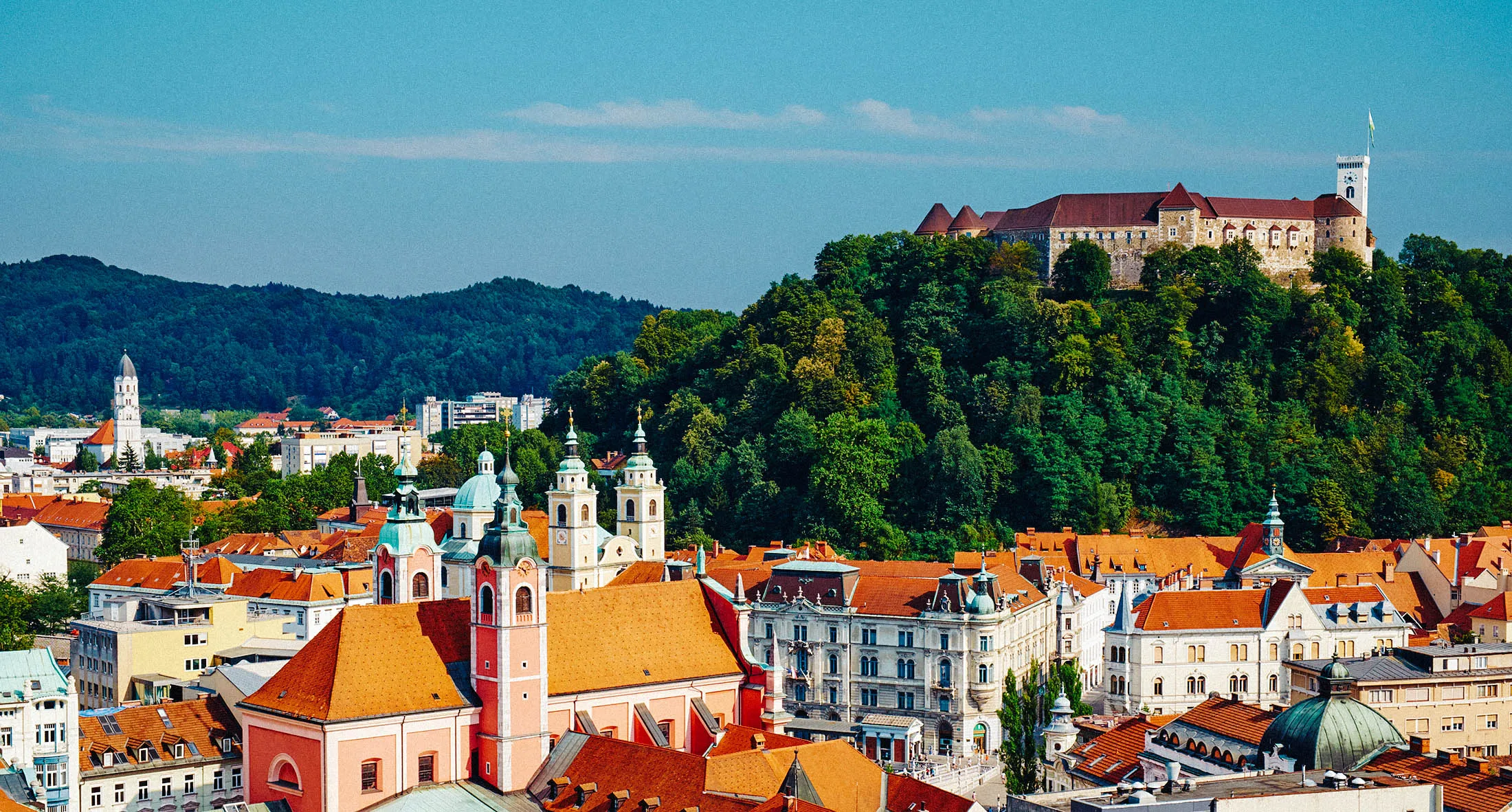 Slovenia, Ljubljana, cityscape with Franciscan church, Saint Nicholas church and the Castle