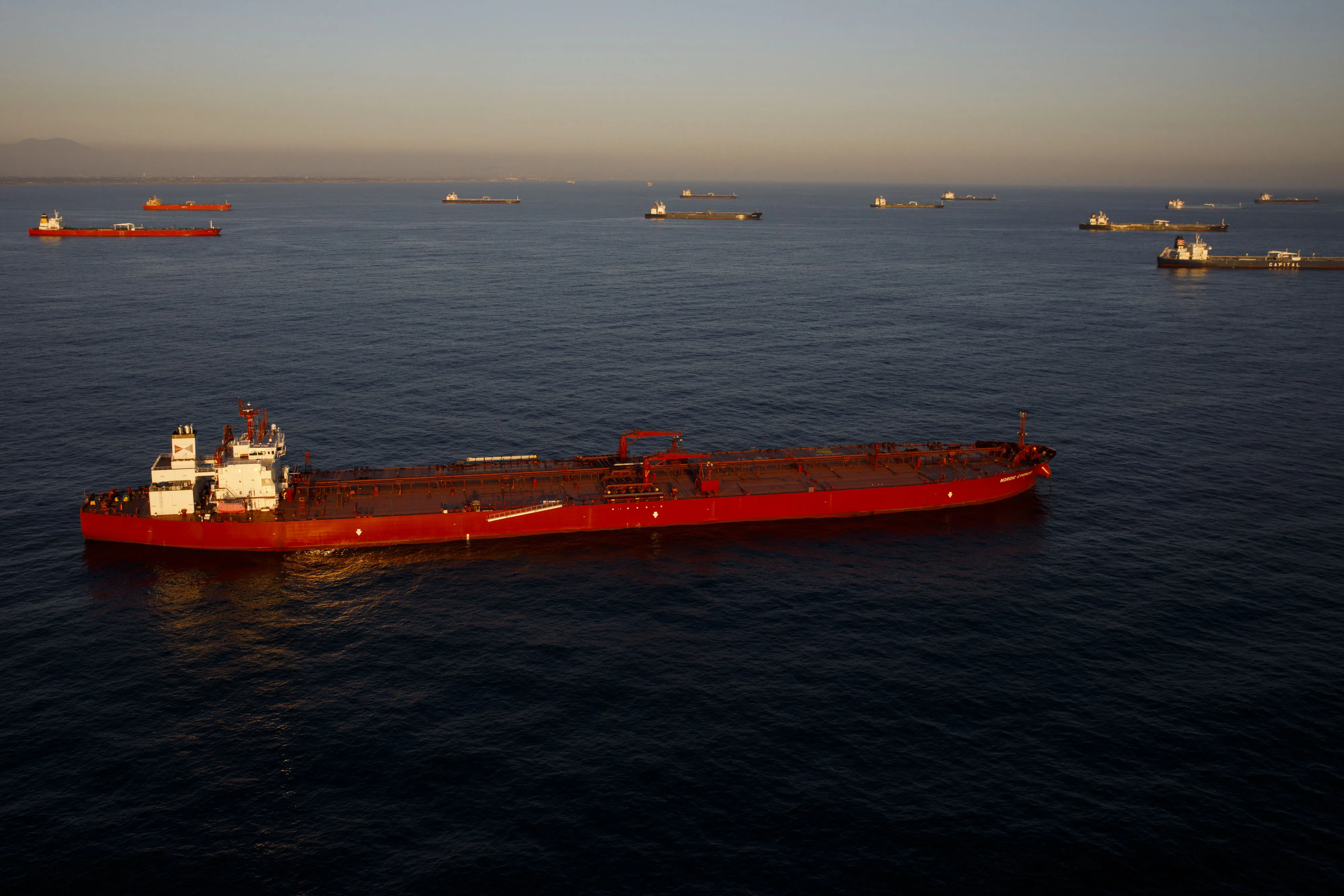 Oil tankers anchored in the Pacific Ocean off Long Beach, California.