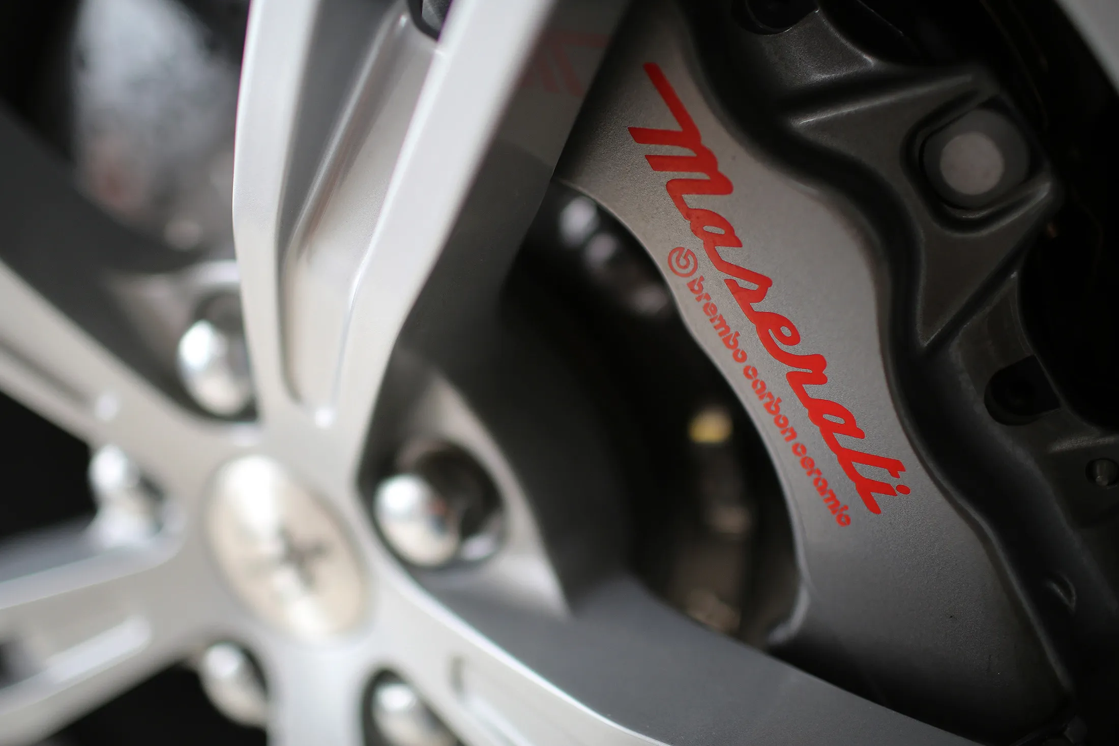 A Maserati logo sits on the brake caliper and wheel assembly of a luxury automobile in the Maserati luxury automobile dealership in Almaty, Kazakhstan, on Thursday, June 25, 2015. Oil-rich Kazakhstan represents the new frontier for the makers of the world's most expensive cars, as China's luxury market slows down.

