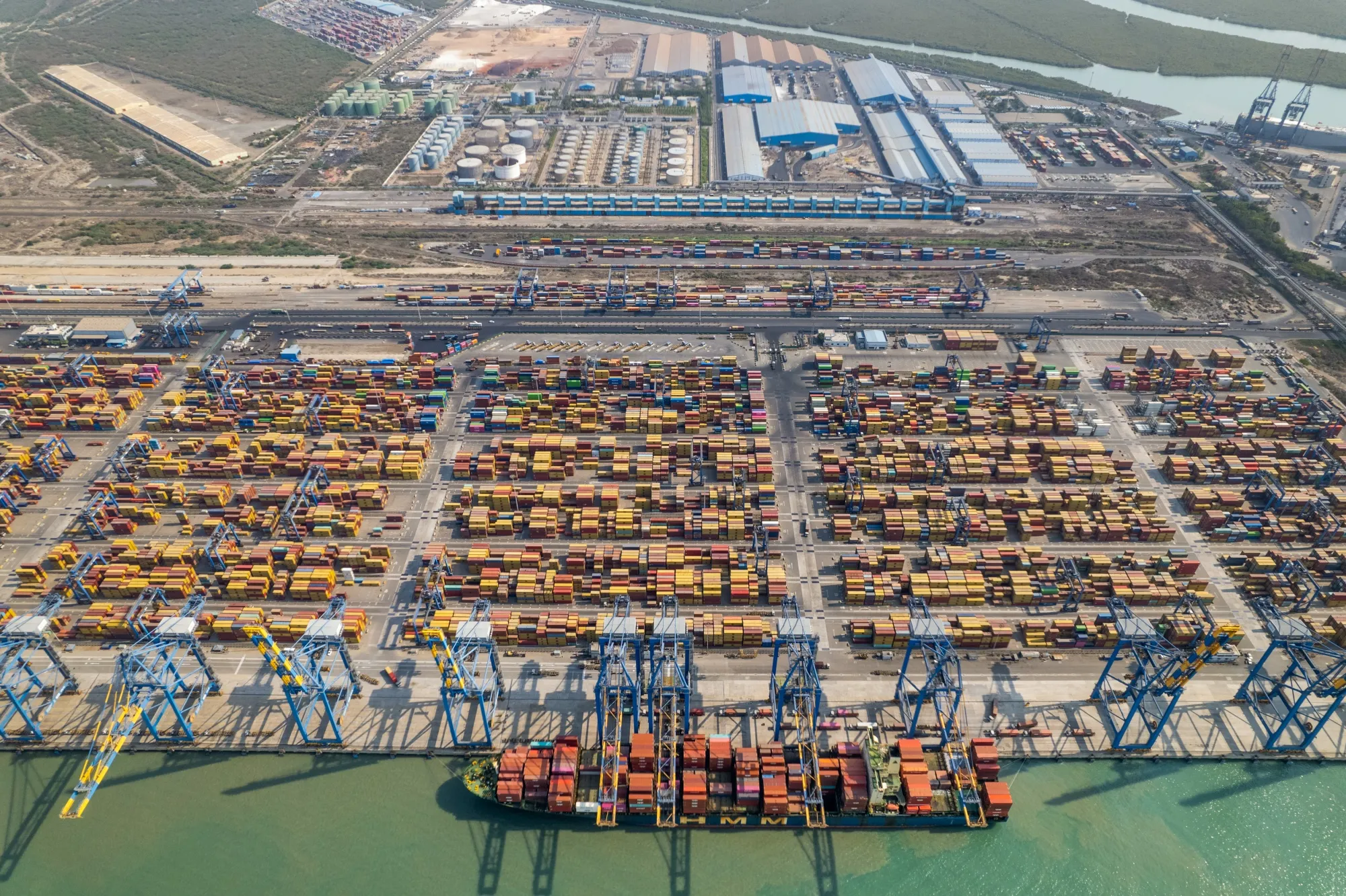 Shipping containers at the Mundra Port of Adani Ports and Special Economic Zone Ltd. in Mundra, Gujarat, India.